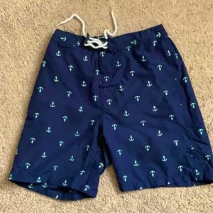 Trendy NEVER WORN swim trunks. Size small, with stretching waistband.